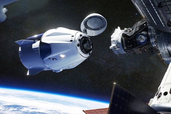 SpaceX Crew Dragon spacecraft docking to the International Space Station. Dragon is capable of carrying up to 7 passengers to and from Earth orbit, and beyond. Elements of this image furnished by NASA // fot. Shutterstock, Inc.